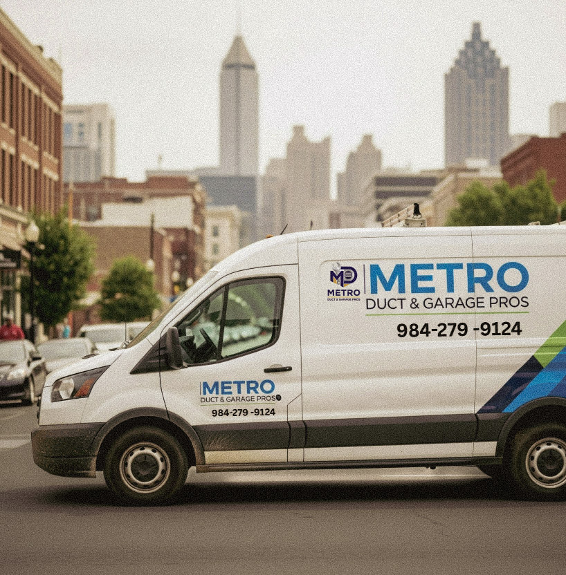 Metro Duct & Garage Pros service van in downtown area